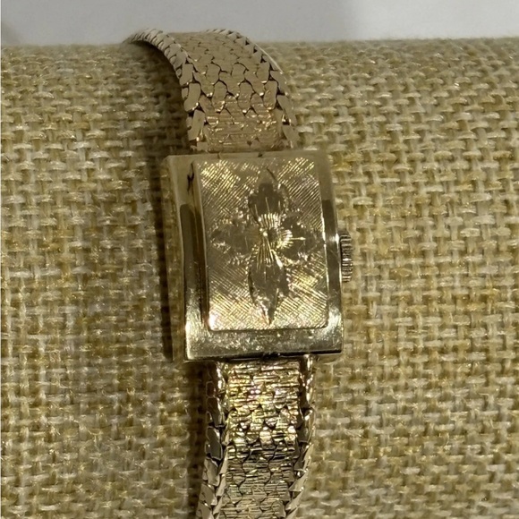 14K Ladies Hidden Watch with Floral Motif on Cover by Geneva 6.5” 23.74 grams - Picture 1 of 4